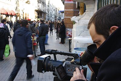 Cameraman working on the street Cameraman working on the street